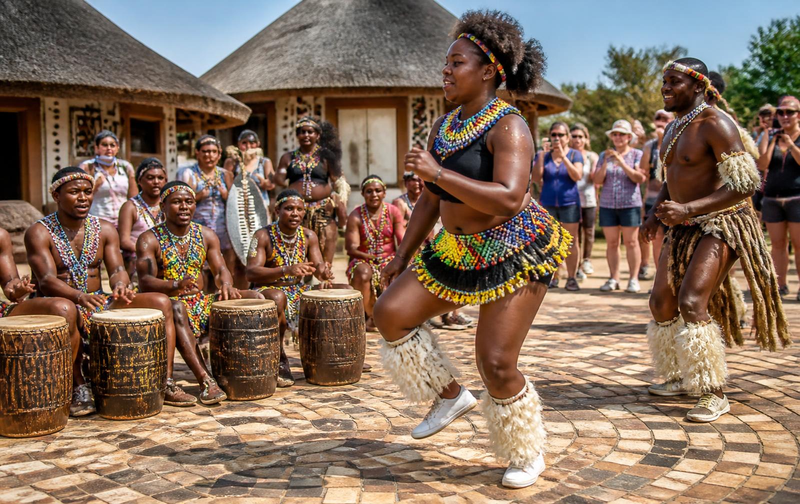 Dancers in beaded traditional dress at a South African cultural village