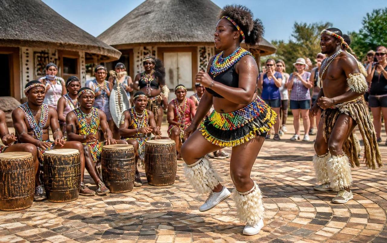 Dancers in beaded traditional dress at a South African cultural village